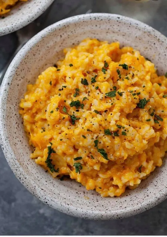Butternut squash risotto garnished with herbs